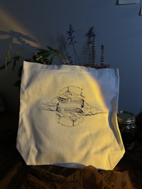 a tote bag with a drawing on it