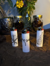 a group of lighters with drawings on them